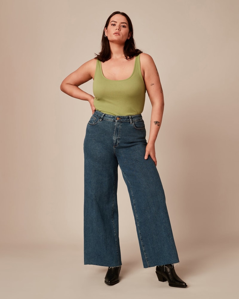 Front of a model wearing a size 1X Scoop Neck Tank in Green by Vince. | dia_product_style_image_id:222204